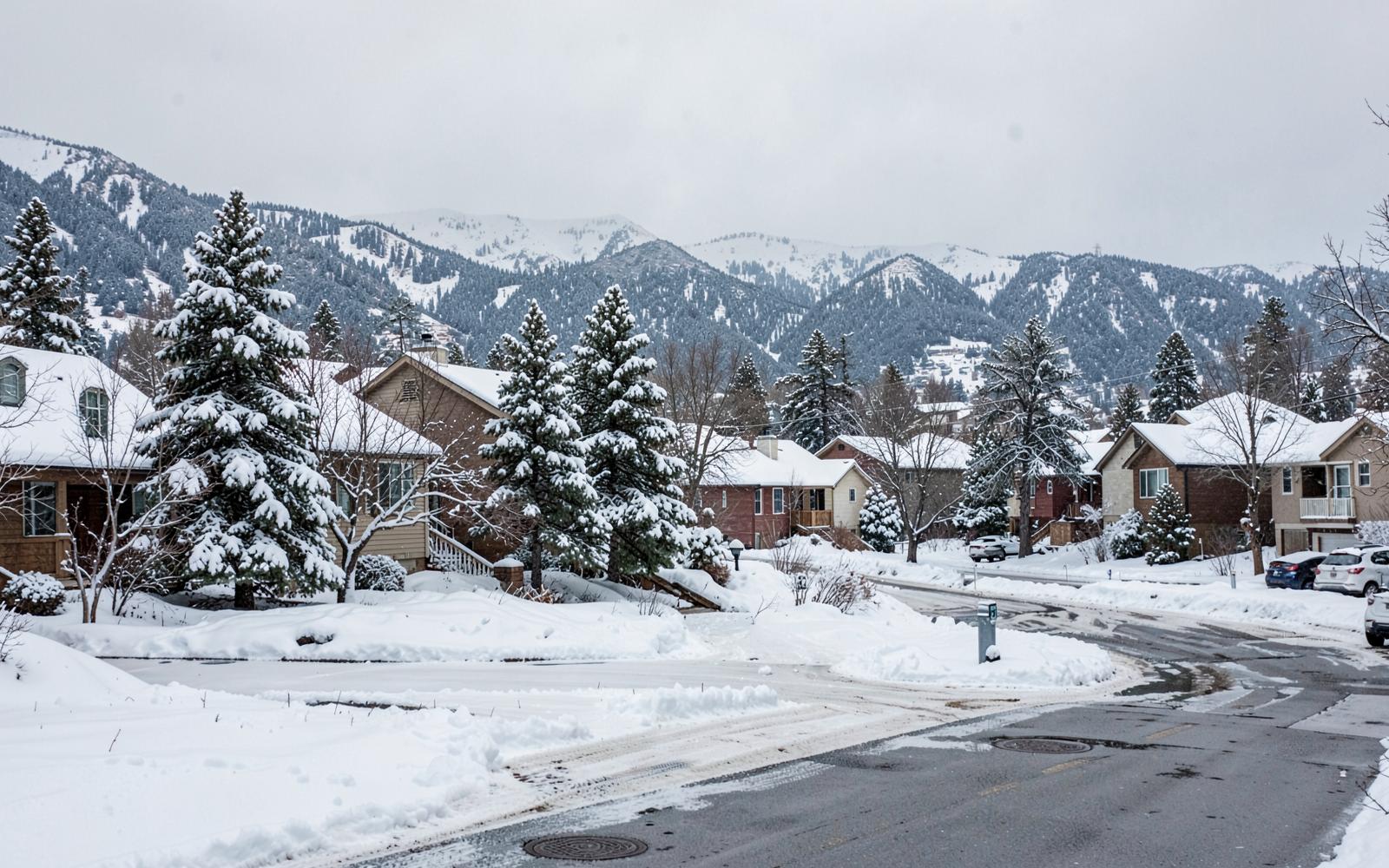 Snow-covered Colorado Springs neighborhood street in winter